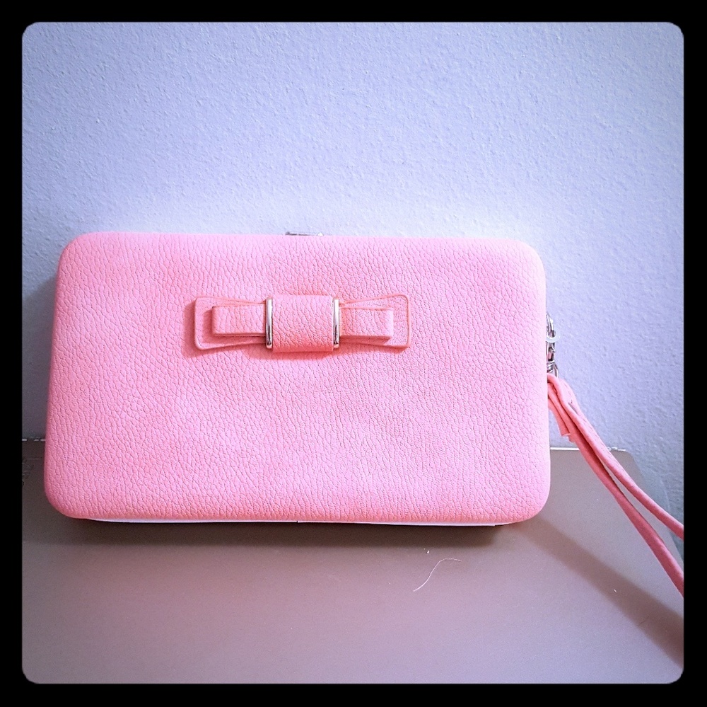 Peach wristlet w/ pink inside, can hold phone&more